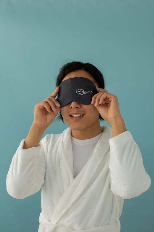 Free Man in White Bathrobe Wearing a Eye Mask Stock Photo