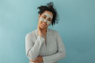 Woman in Gray Sweater with Facial Care