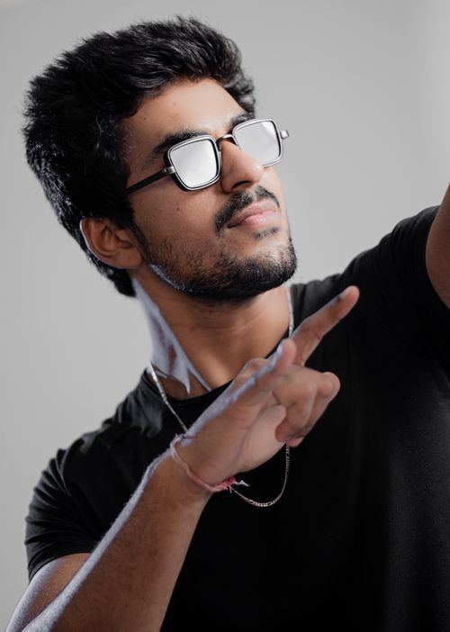 Free Man in Black Crew Neck Shirt Wearing Black Framed Eyeglasses Stock Photo