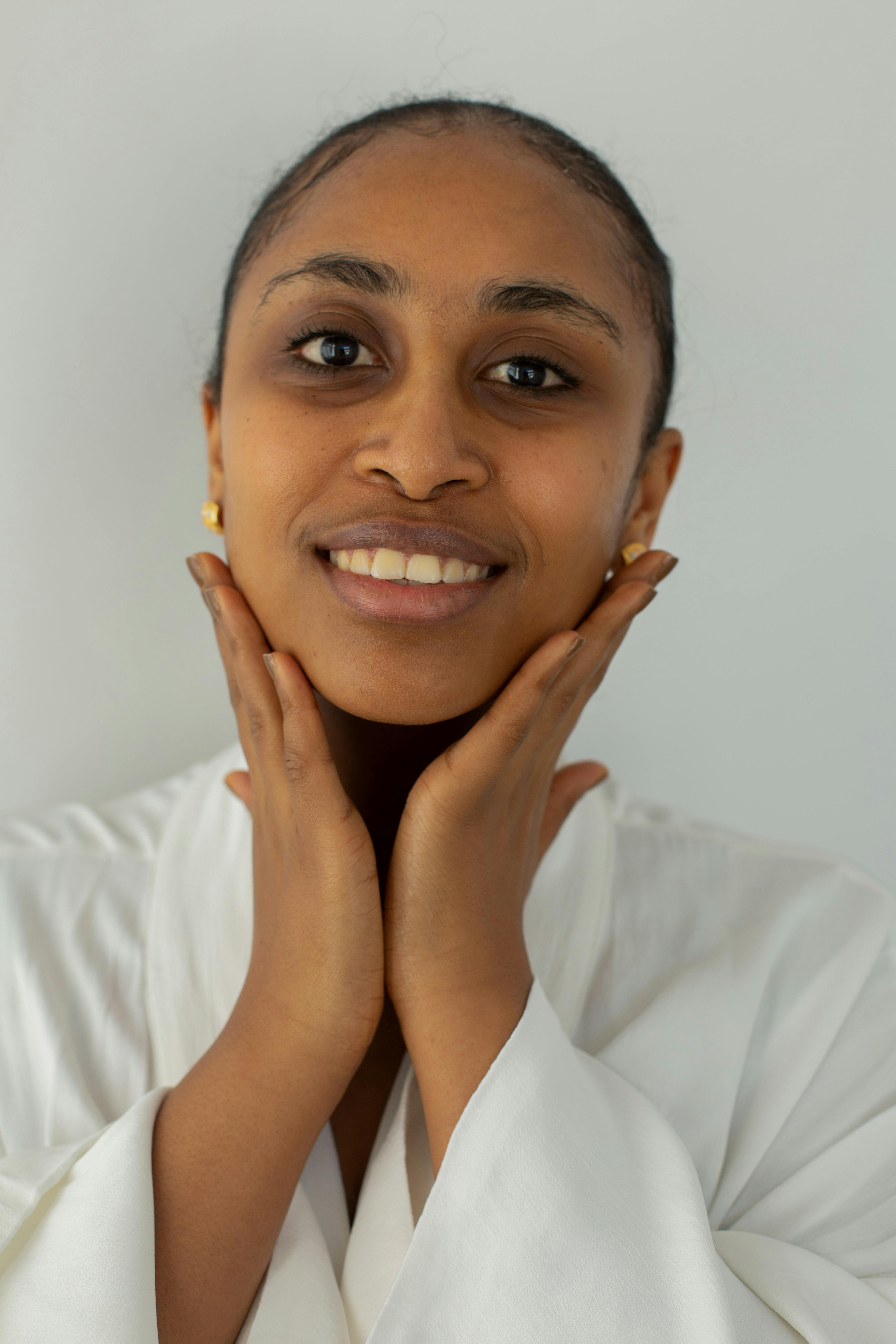 Profile of Indian woman smiling and touching her hair Stock Photo - Alamy