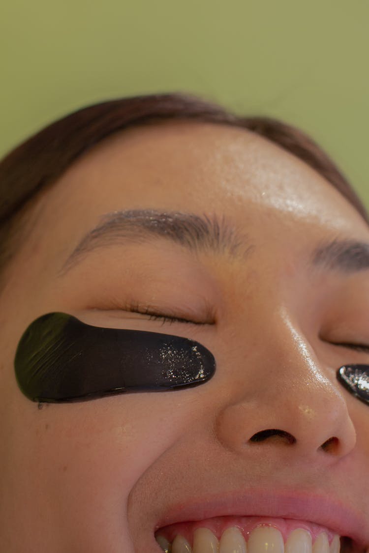 Crop Cheerful Ethnic Teen With Eye Patches On Cheeks