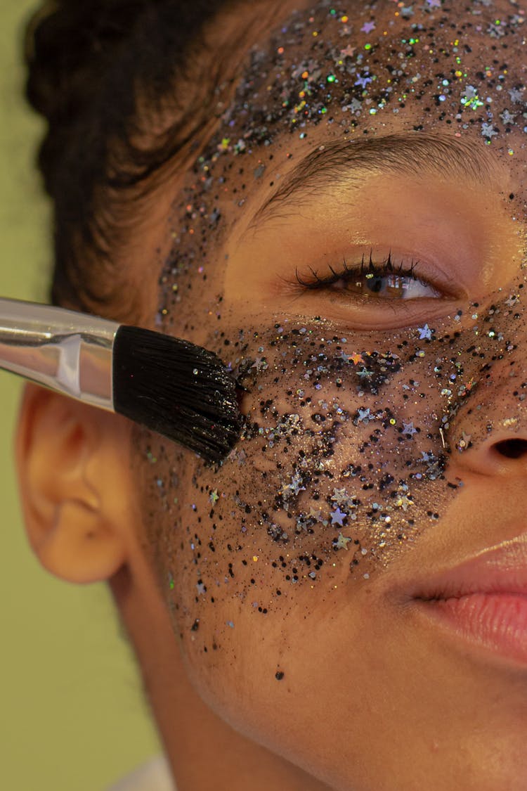 Anonymous Content Black Woman Applying Facial Mask On Face