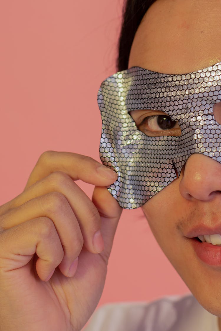 Anonymous Positive Asian Man With Eye Mask In Studio