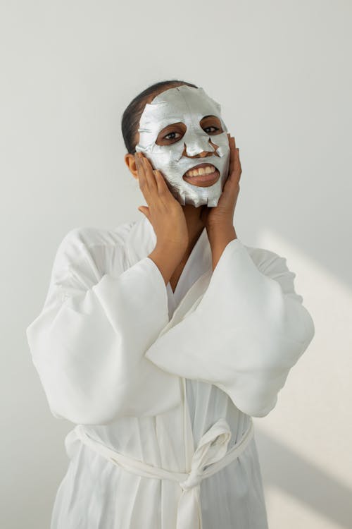 Anonymous black woman with facial mask