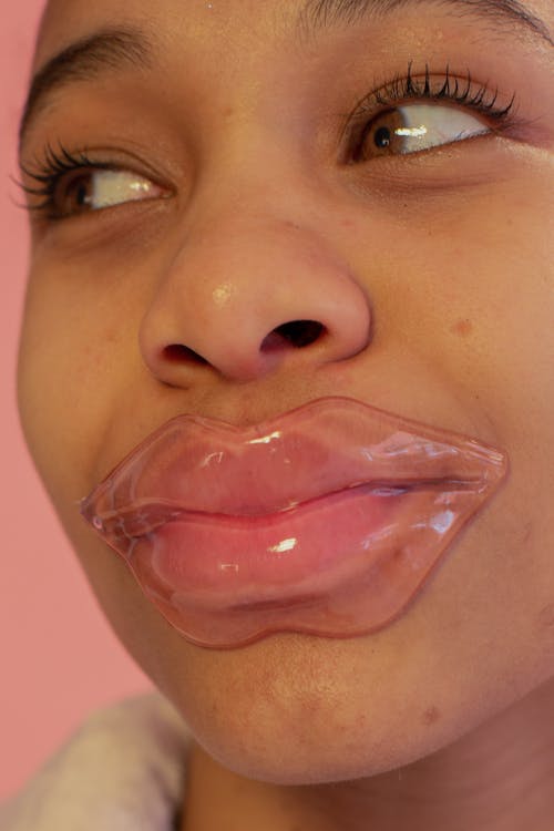 Black woman with lip mask
