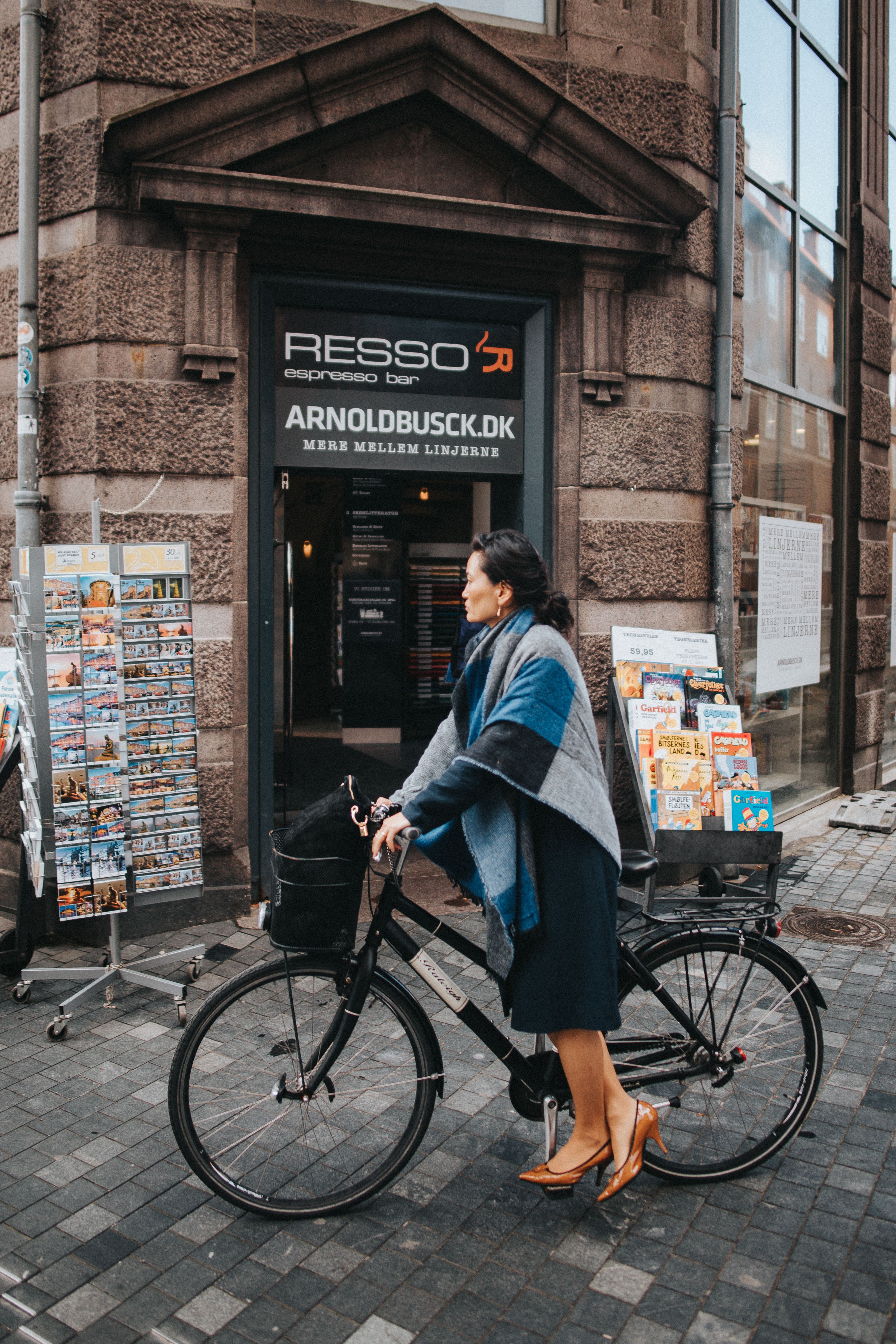 Woman in Black Dress Standing beside Black Bicycle · Free Stock Photo