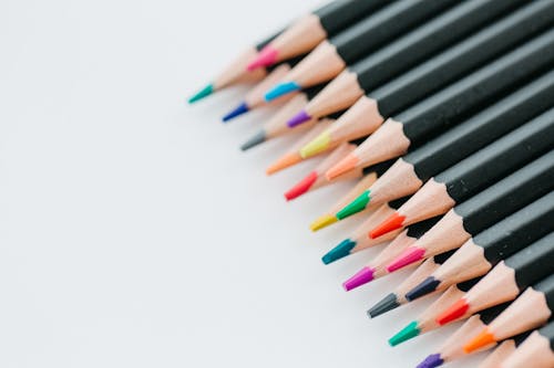 Close-up Shot of Colored Pencils on a White Surface