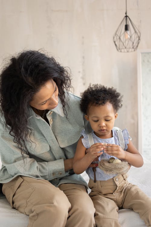 Close-Up Shot of a Mother Looking at her Son