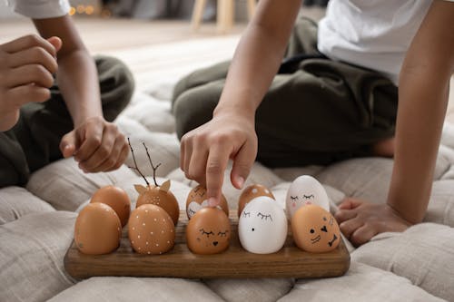 Painted Eggs on Wooden Board
