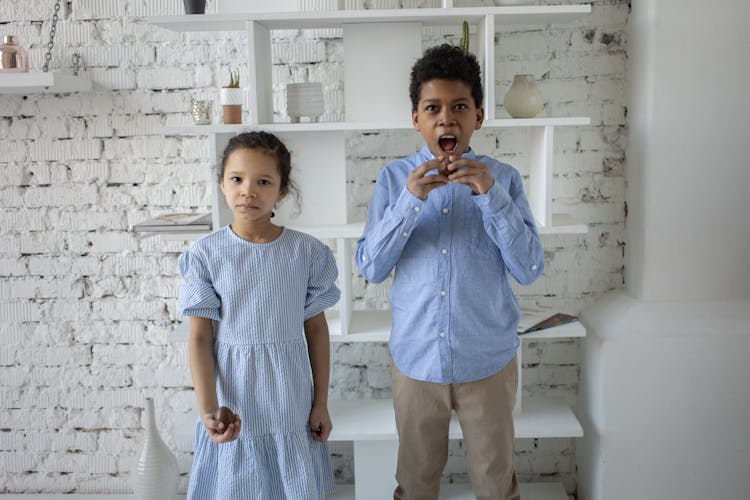 Siblings Eating Chocolate Eggs