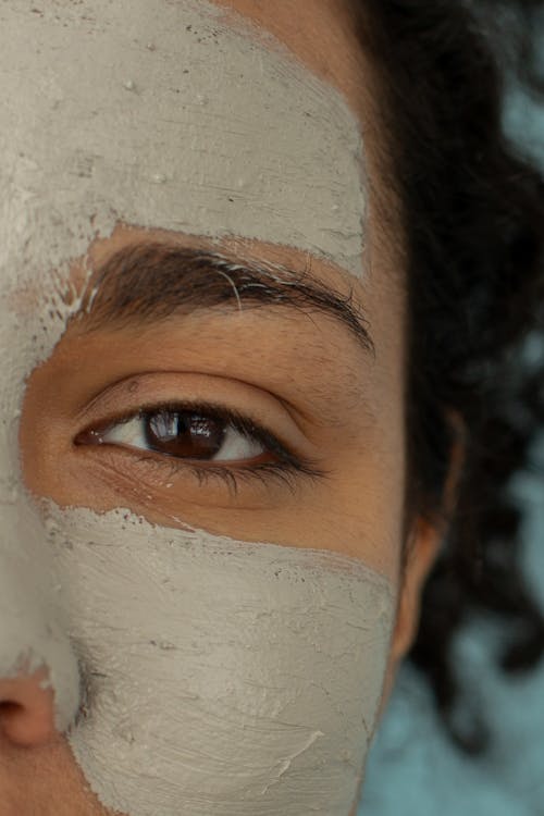 Free Anonymous black woman with clay mask Stock Photo