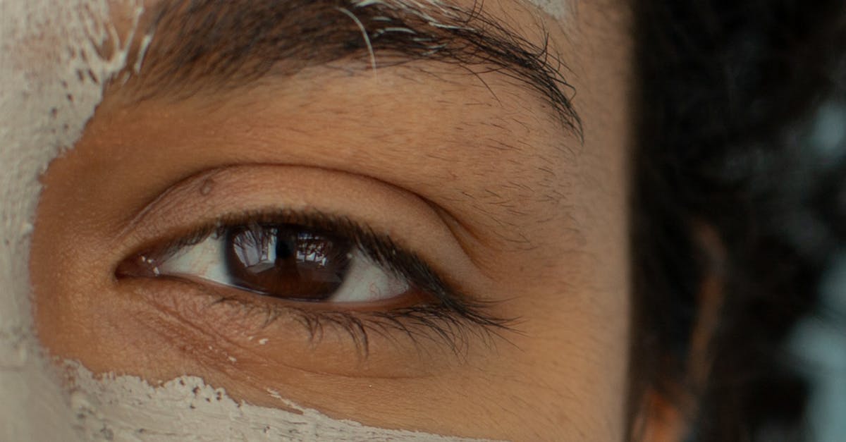 A young woman using a gentle facial cleanser to wash her face in the morning.
