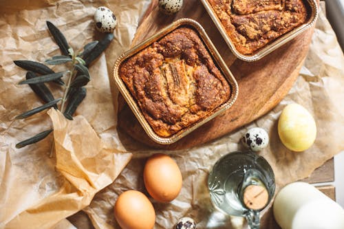 Top View of Homemade Cakes and Ingredients on a Table 