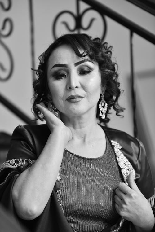 Black and White Photo of a Woman Holding her Hair