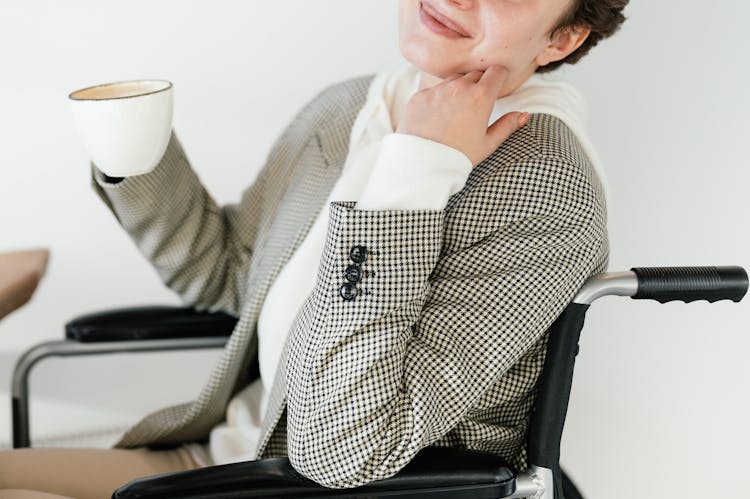 Crop Woman In Wheelchair With Coffee