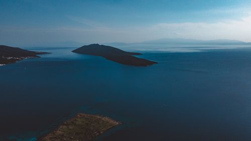 Free Breathtaking aerial shot of islands surrounded by the deep blue ocean, ideal for travel imagery. Stock Photo