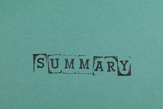 Close-Up Shot of a Text on a Green Surface