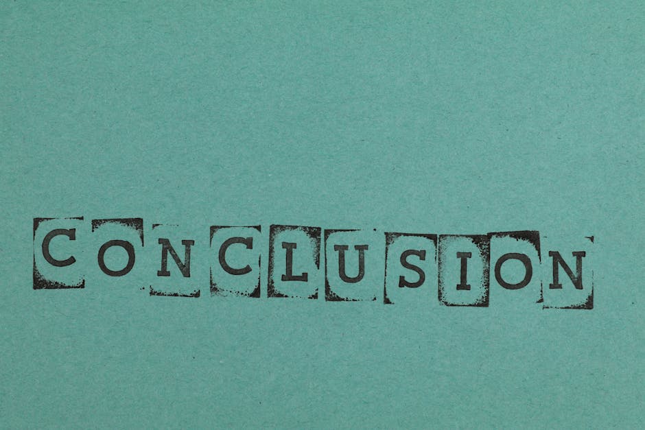 Conclusion word stamped on textured blue paper with block letters, conveying finality.