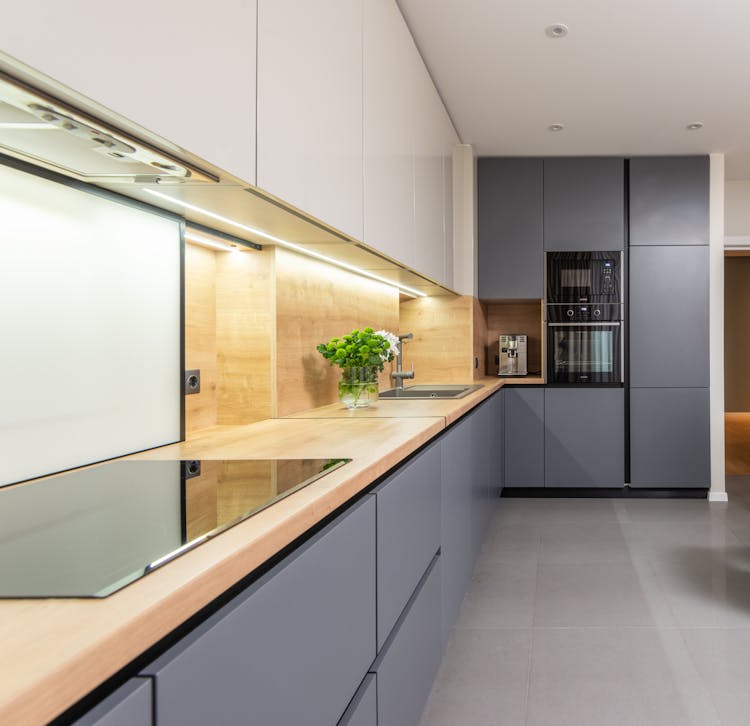 Modern Kitchen Interior With Electric Stove And Appliances At Home