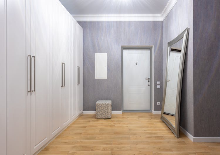 Corridor Interior With Closet Against Mirror In House