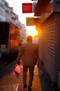 Man Walking on Sidewalk