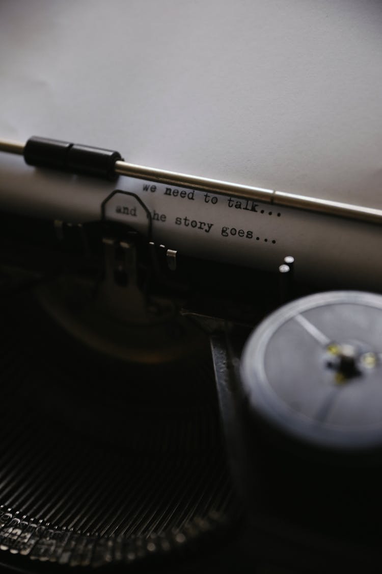 A Paper On A Typewriter With Typewritten Words