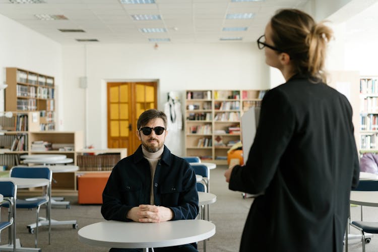 A Blind Man Sitting In Class