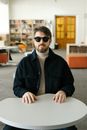 Man in Black Coat wearing Sunglasses