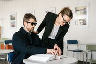 Woman Assisting a Blind Man