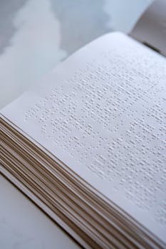 Detailed view of a Braille book's tactile text, highlighting texture and accessibility.