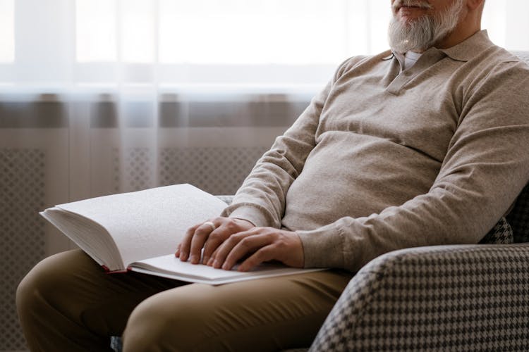 Blind Man Reading A Braille