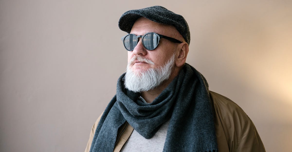 Person in Brown Jacket Wearing Gray Scarf and Brown Sunglasses