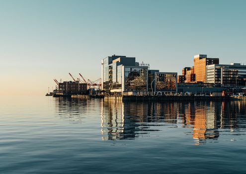 Port on sea near buildings in city
