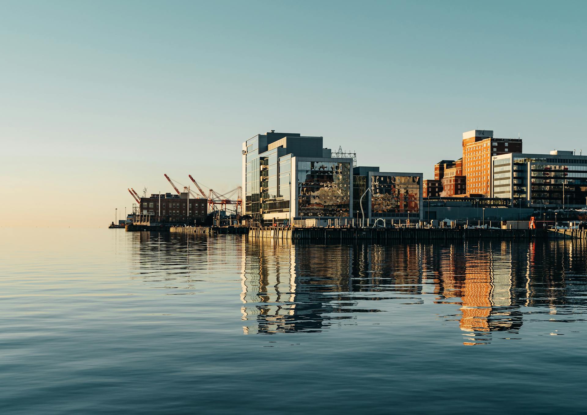 Port on sea near buildings in city