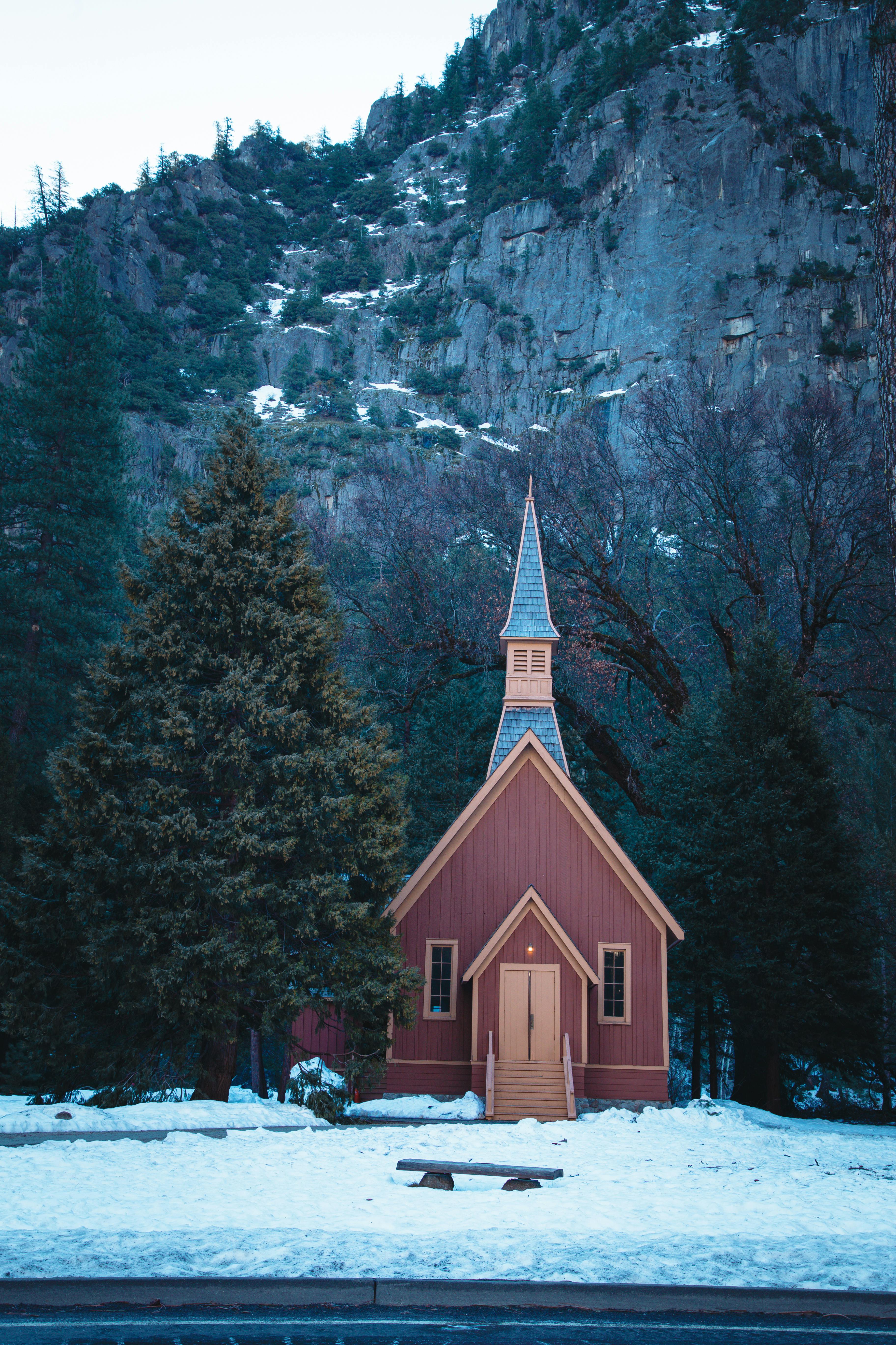 Prescription Goggle Inserts - Idyllic winter view of Yosemite Valley Chapel set against snow-covered terrain and majestic cliffs.