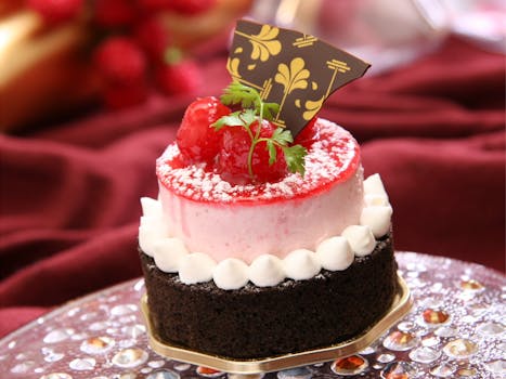 Chocolate Cake With White Icing and Strawberry on Top With Chocolate