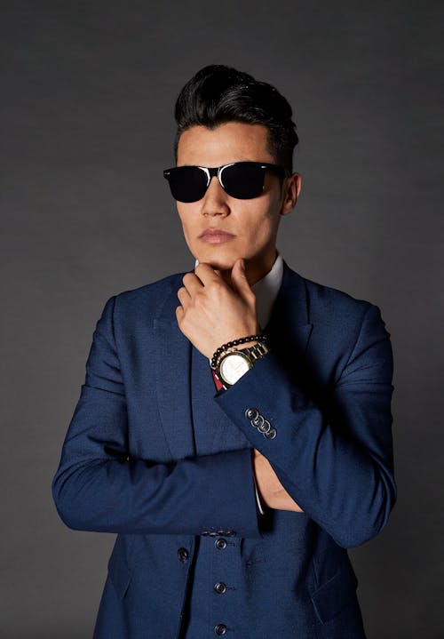 Man in Blue Suit Wearing Black Sunglasses