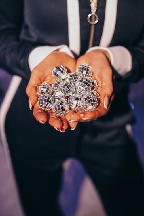 Close-up of Holding Small Disco Balls