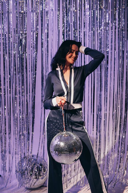 Free Woman Holding a Disco Ball Stock Photo