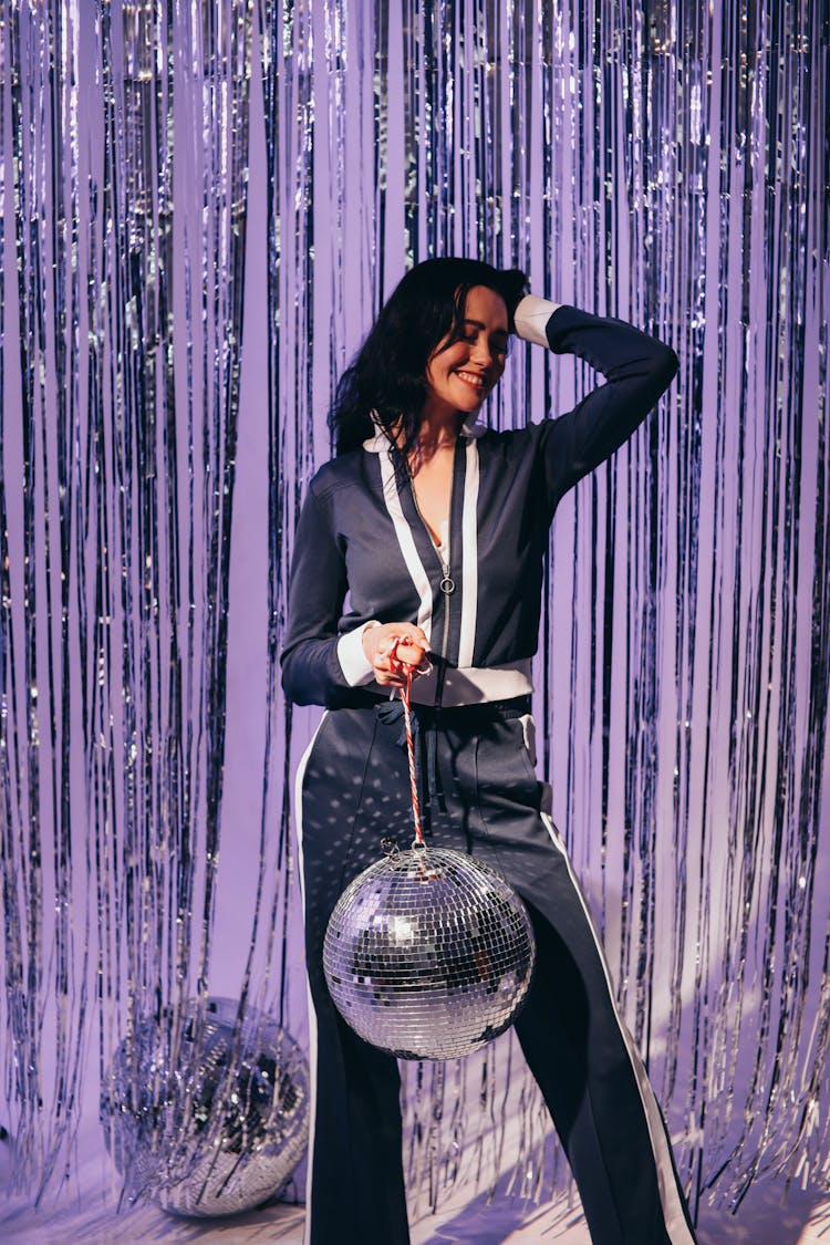 Woman Holding A Disco Ball