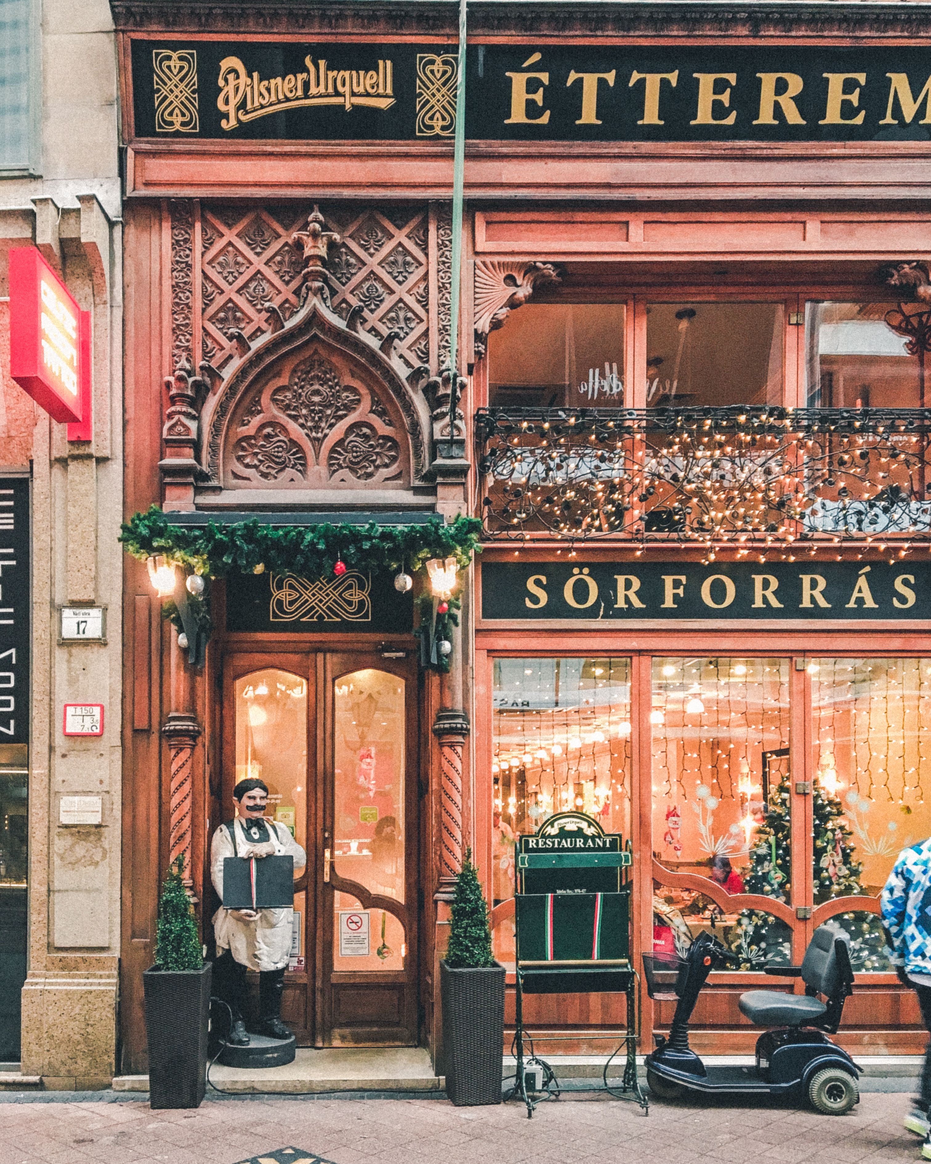 People Sitting on Bench in Front of Brown Wooden Store · Free Stock Photo