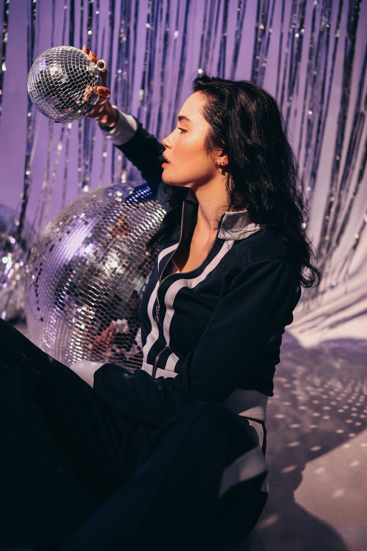 Woman Holding A Disco Ball