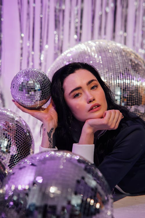 Beautiful Woman Holding a Disco Ball