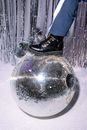Person in Blue Denim Jeans and Black Leather Boots Standing on White Snow Covered Ground