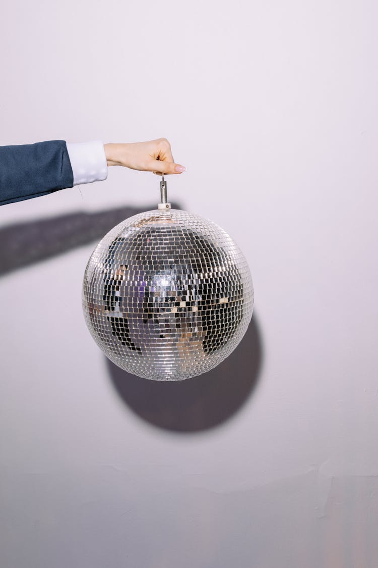 Person Holding A Disco Ball