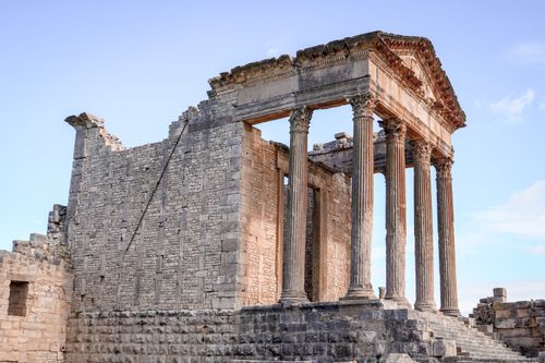 Free Stunning view of ancient Roman temple ruins showcasing classic architecture in Tunisia. Stock Photo