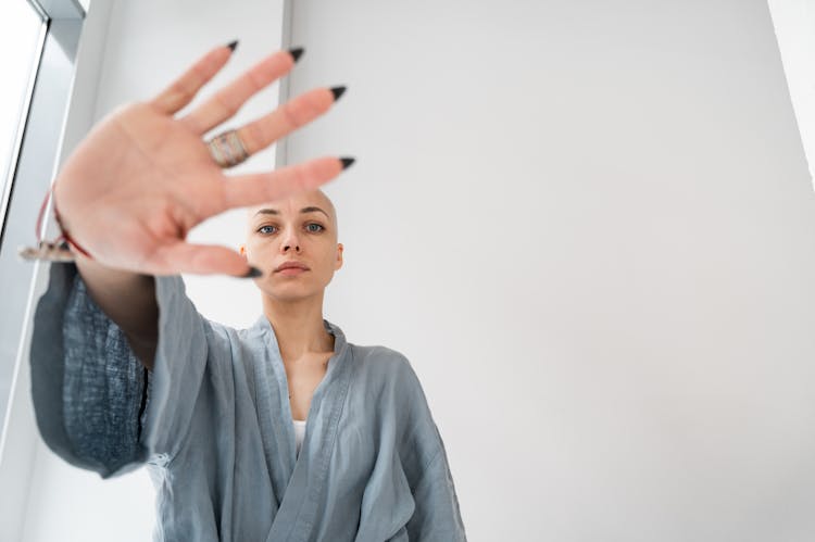 Patient Showing Stop Gesture In Light Clinic