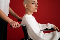 Crop assistant against handicapped patient in wheelchair