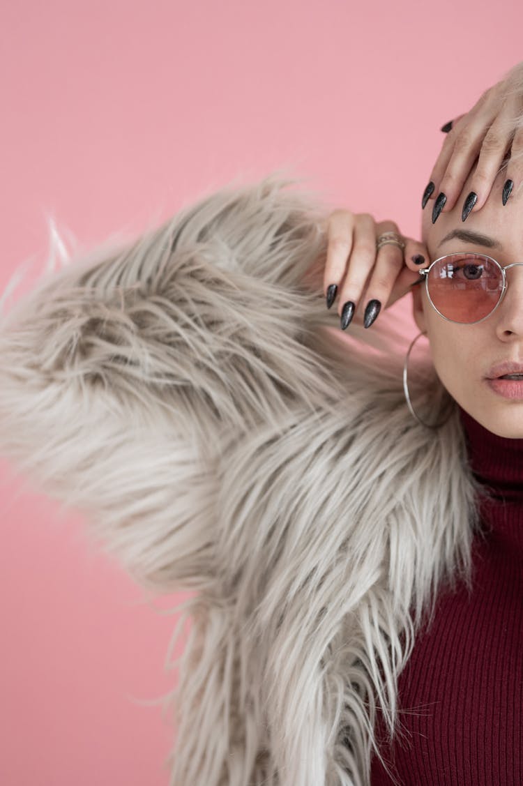 Fashionable Woman In Fur Coat And Sunglasses