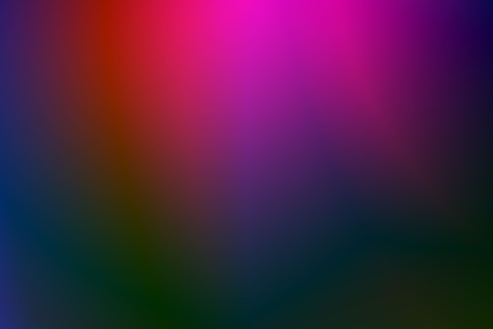 A vivid abstract background featuring a seamless gradient of vibrant colors including pink, purple, and blue.